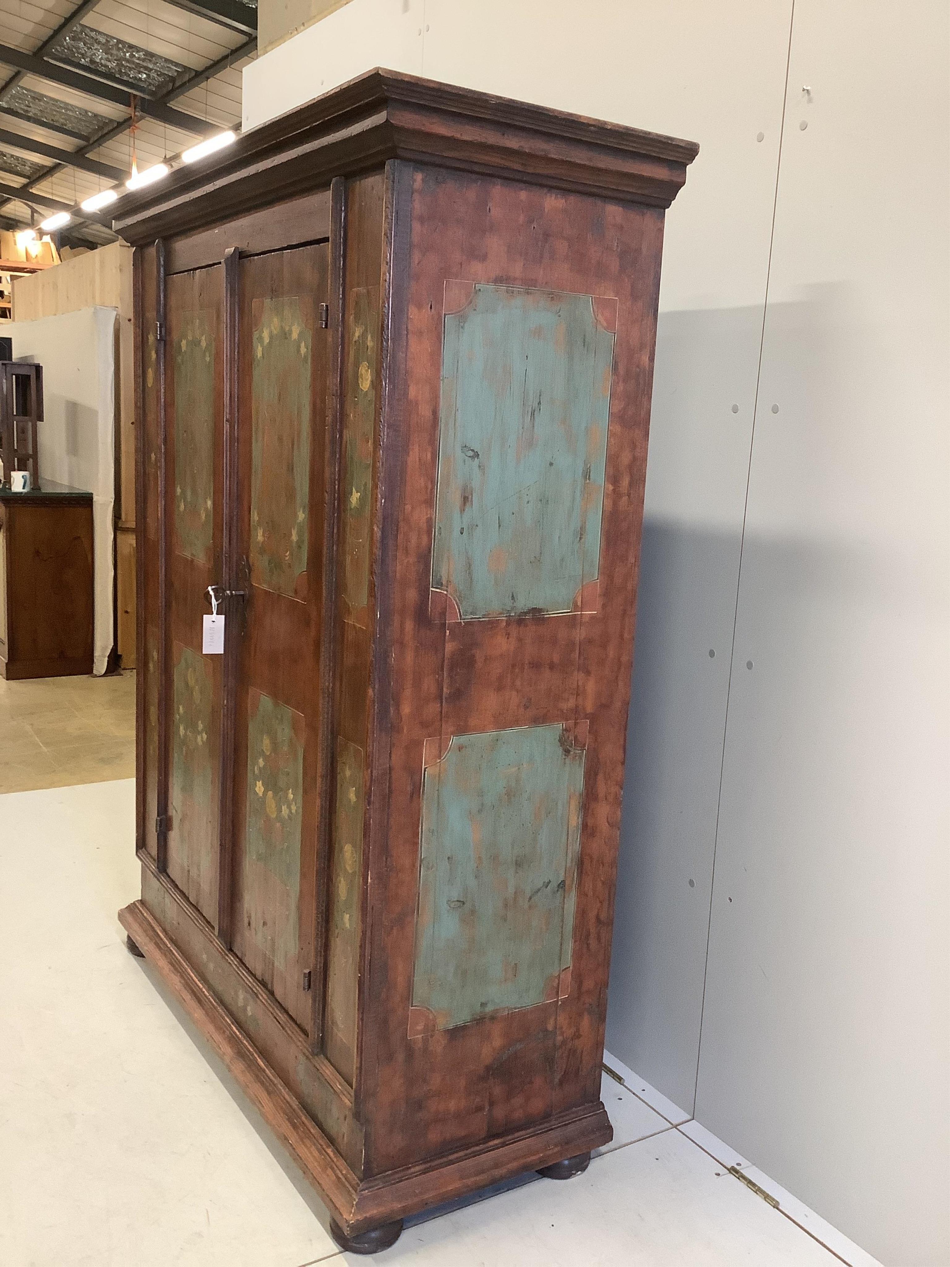 An 18th century Swiss painted pine armoire, width 131cm, depth 54cm, height 169cm. Condition - fair